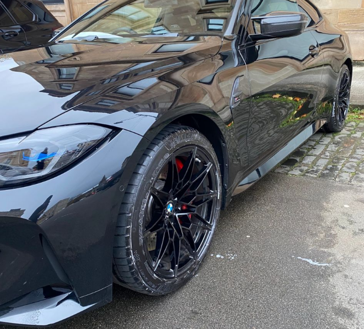 Glossy black BMW after professional mobile car valet in Scotland