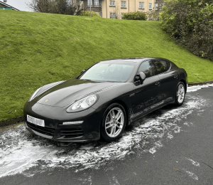 Mobile car wash Glasgow – black Porsche being washed with foam on driveway