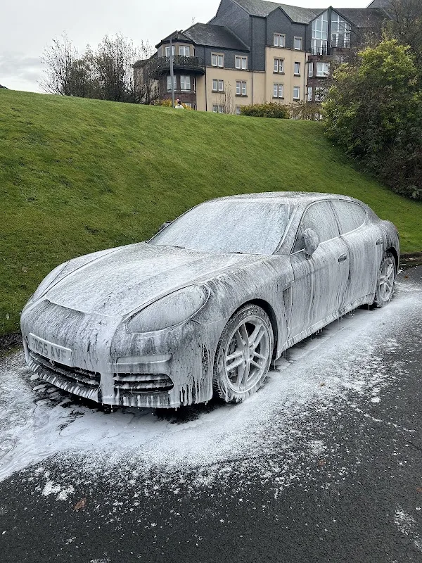 Porsche Panamera covered in snow foam before valet